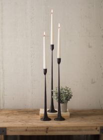 SET OF THREE TALL CAST IRON TAPER CANDLE HOLDERS