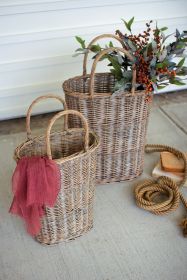 SET OF TWO TALL OVAL WICKER BASKETS