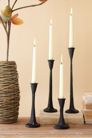 SET OF FOUR CAST IRON TAPER CANDLE HOLDERS