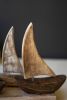 FIVE WOODEN SAIL BOATS ON A BASE