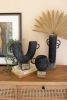 SET OF THREE BLACK MODERN CLAY VASES ON ROCK BASES