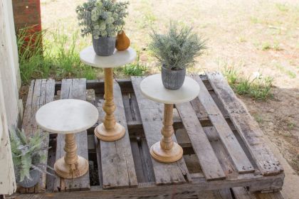 SET OF THREE WOODEN DISPLAY STANDS WITH WHITE MARBLE TOPS