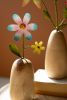 SET OF THREE PAINTED METAL FLOWERS WITH WOODEN BASES