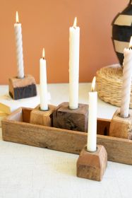 FIVE RECYCLED WOOD TAPER CANDLE HOLDERS IN A WOODEN TRAY